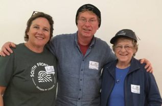 L>R: Laurie Swinton, Presenter; Michael Gemmell, SFMS' most recent member; Irene Bauder, SFMS' Longest member. Both members are wearing Township headgear presented by Swinton.